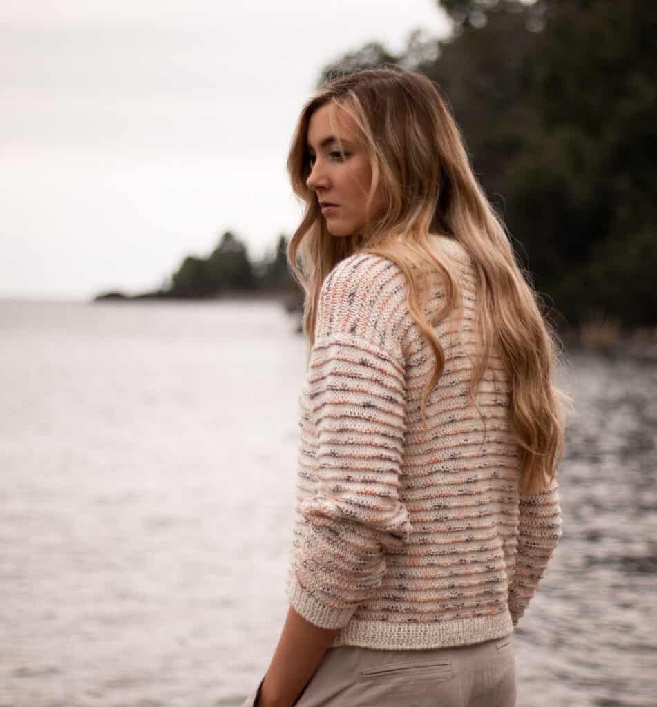 Piper Sweater Knitting Pattern on model near water
