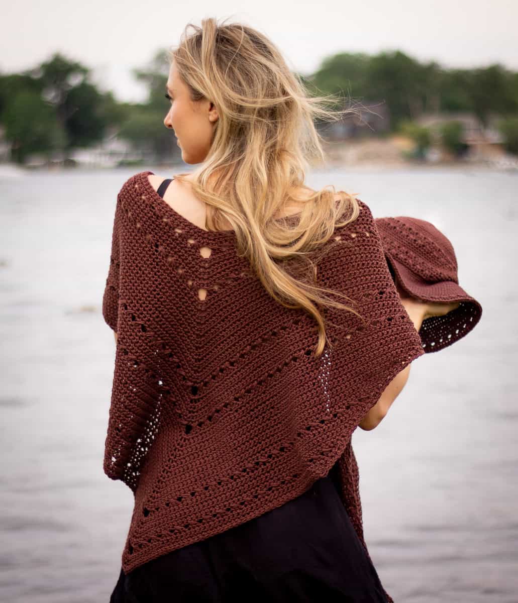 Seaside shawl being worn over shoulders shown from the back to show the simple eyelet detailing