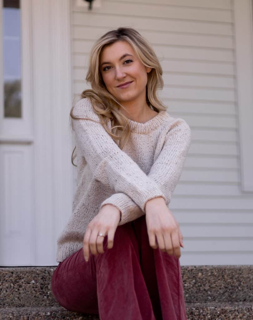 Arms crossed in front of sweater showcasing the way the sweater folds and drapes nicely