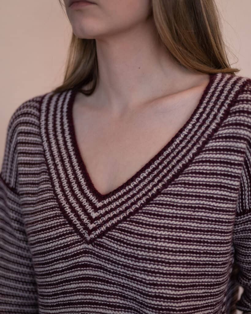 closeup image of the V neckline of the seasons sweater knitting pattern